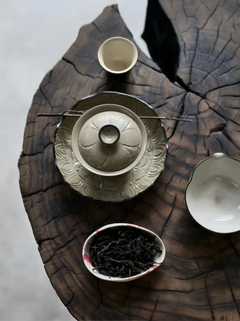 Master artisan hand-carving traditional Yaozhou kiln celadon porcelain for Ymtea bespoke collections